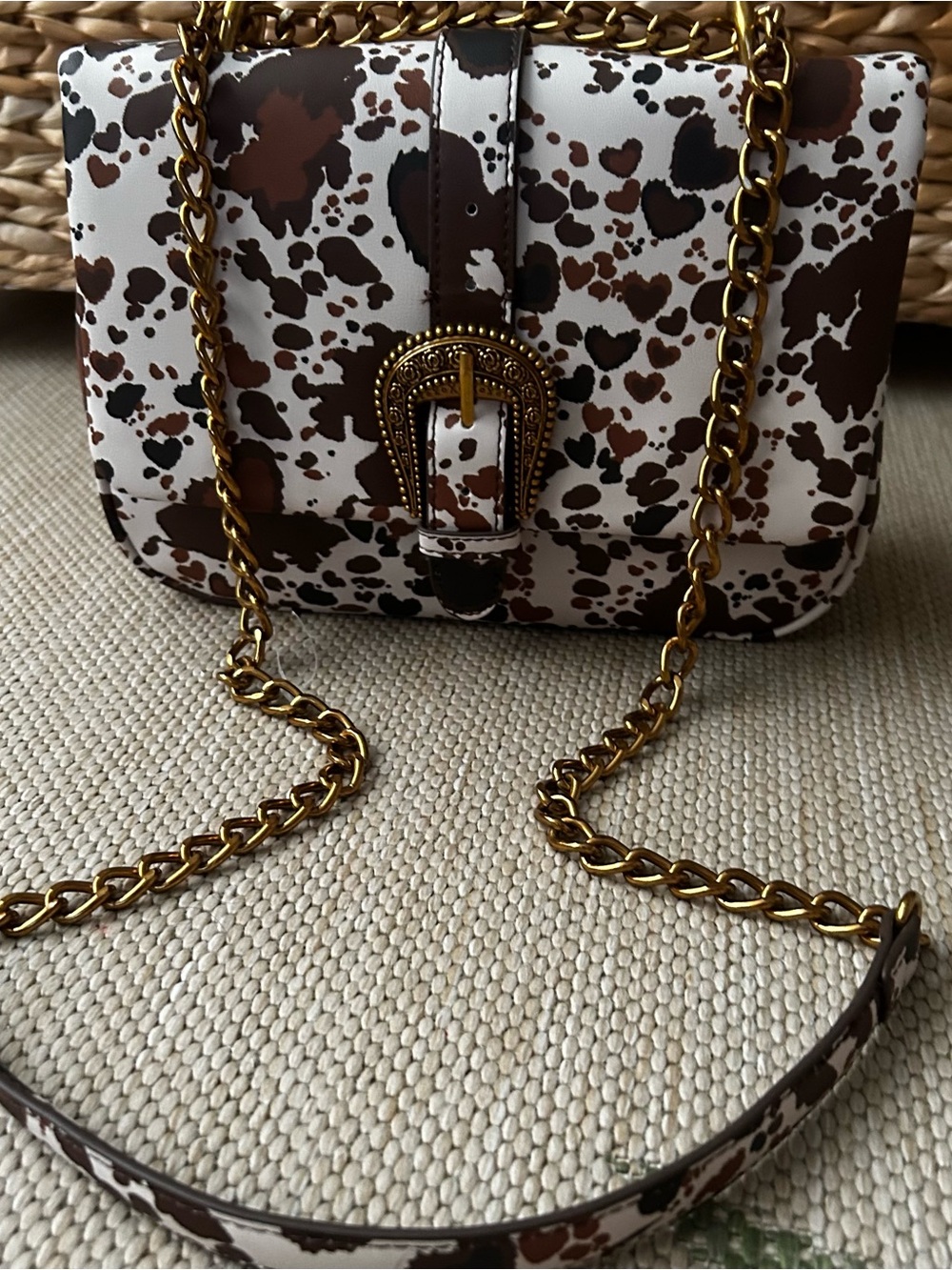Betsey Johnson Brown and White Cow-Print Crossbody with Gold Tone Chain/Hardware